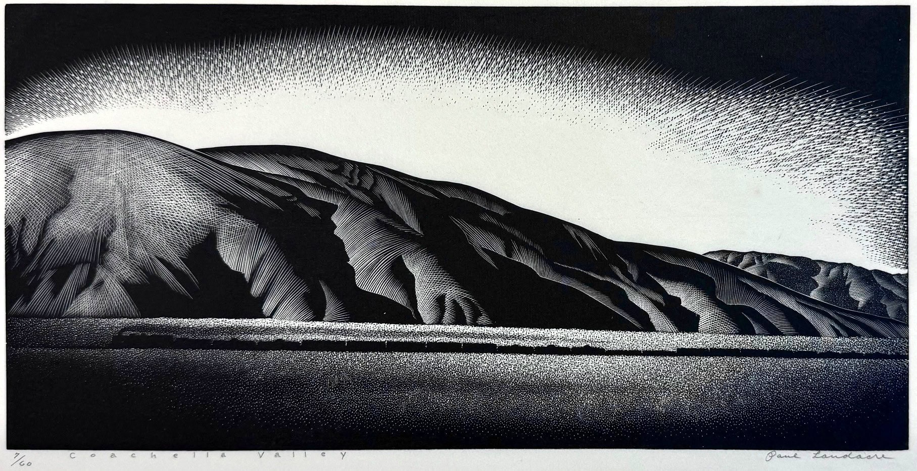 Image of Wood engraving by artist Paul Landacre, entitled "Coachella Valley" and illustrating the mountains bordering the valley with a small train billowing smoke.